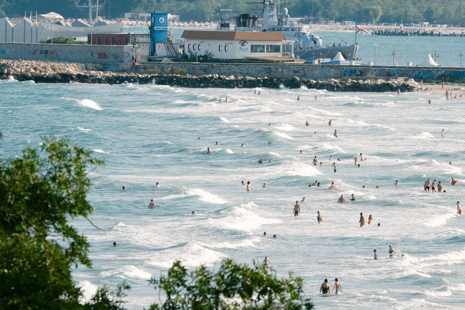 Summer waves and beachgoers on the Bulgarian Black Sea coast. Photo by Ramon Karolan.
