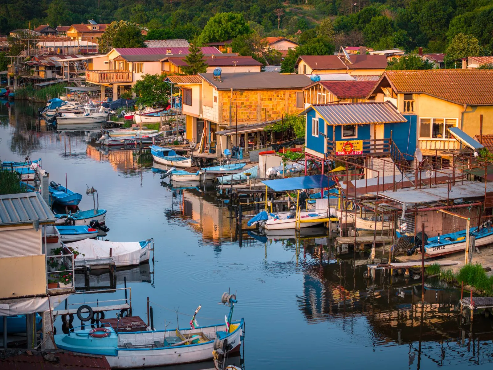 Fishing boats moored by a coastal village at sunrise, Burgas region, Bulgaria. Photo by Sergey Guk.