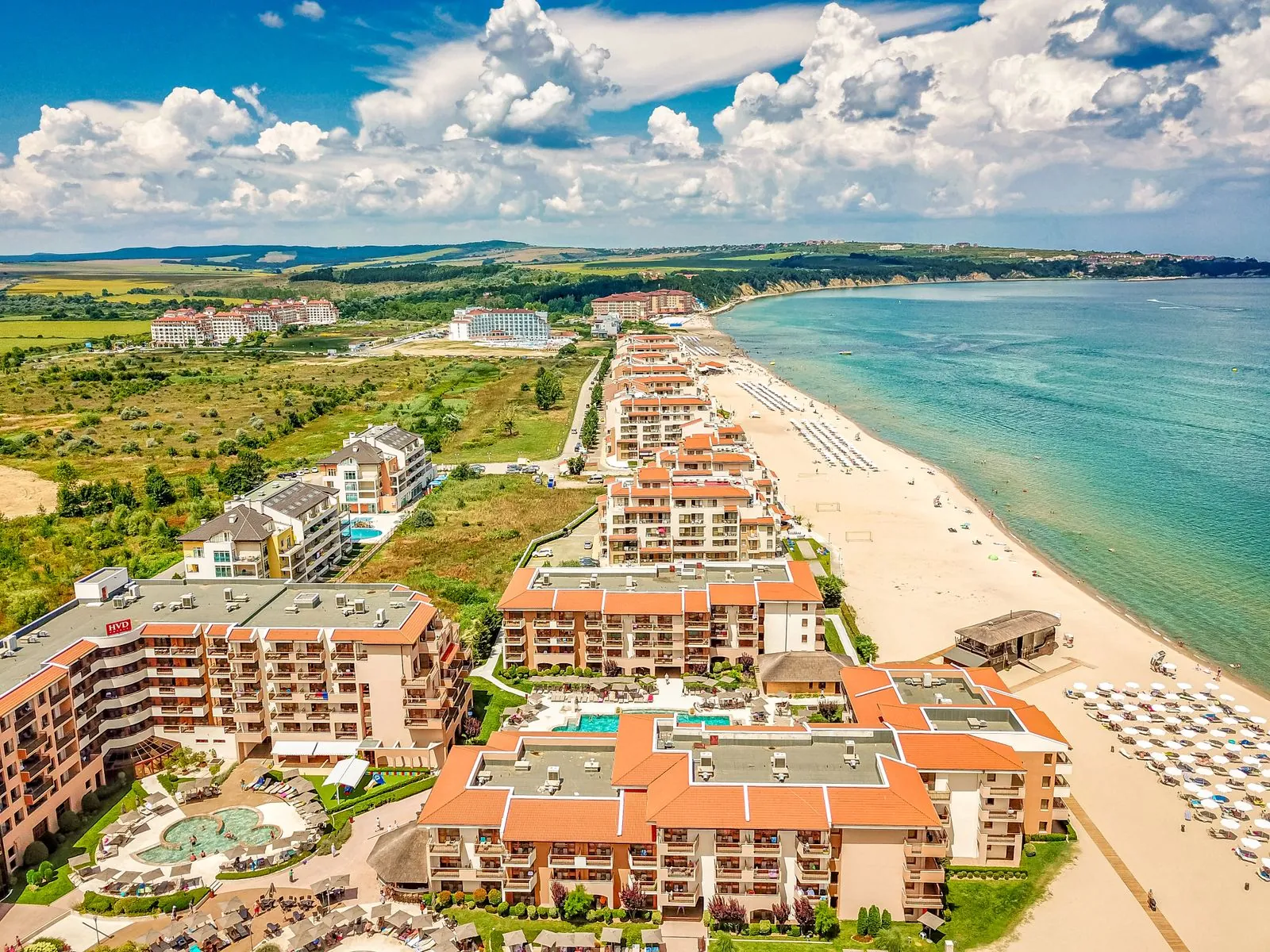 Aerial view of beachside resort buildings and coastline in Obzor, Bulgaria. Photo by Nextvoyage.
