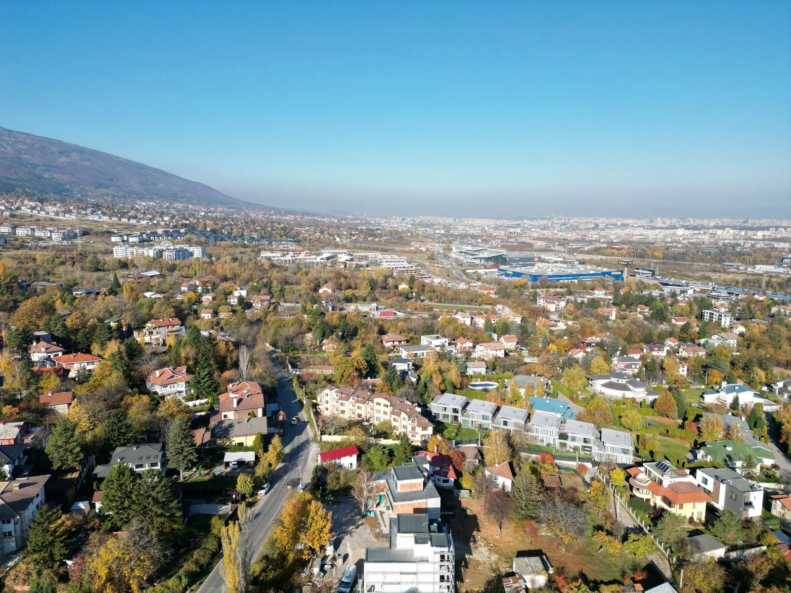 Aerial view of Sofia with mountains in the distance. Photo by M P.