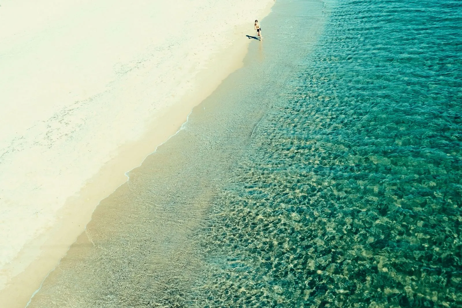 Aerial view of turquoise waves and golden sand on Varna beach. Photo by Nadejda Bostanova.